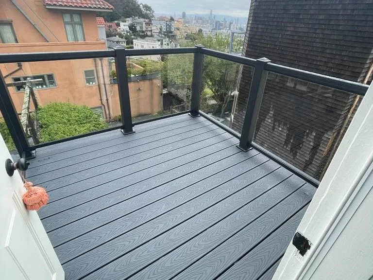 Composite balcony deck with a black-framed glass railing and a city view, the photo shown for Grand Ave, South Pasadena