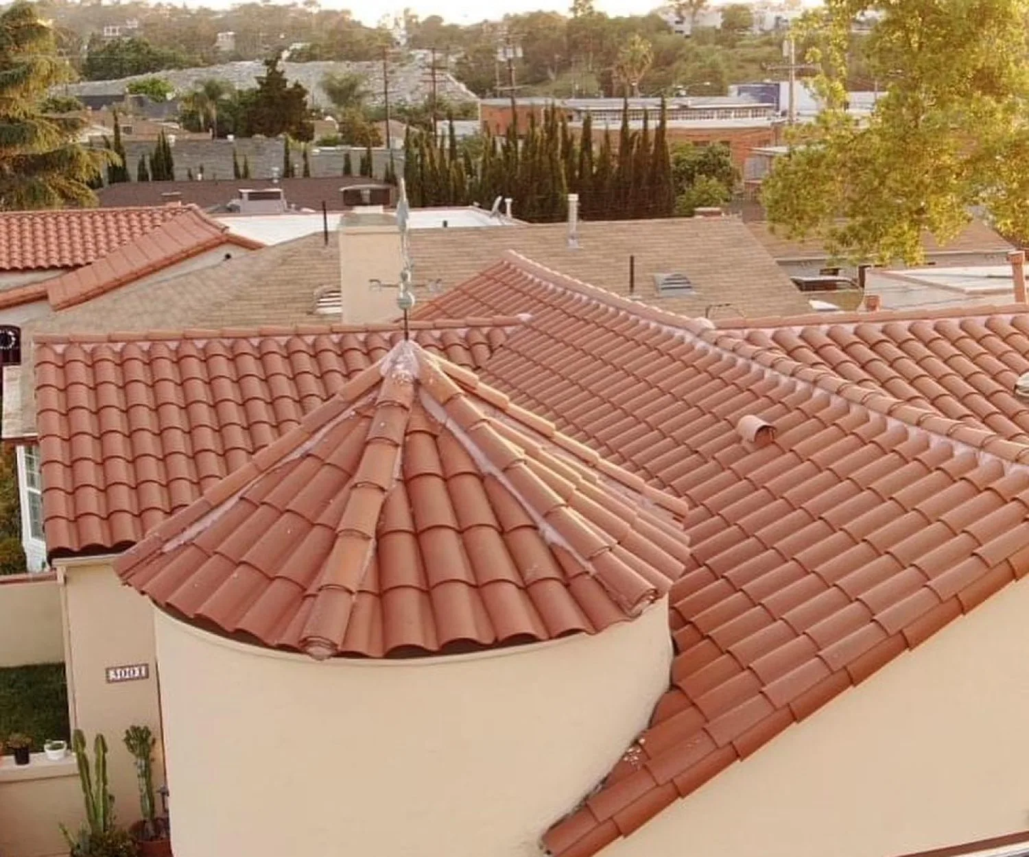 Red clay barrel tile roof with a round turret