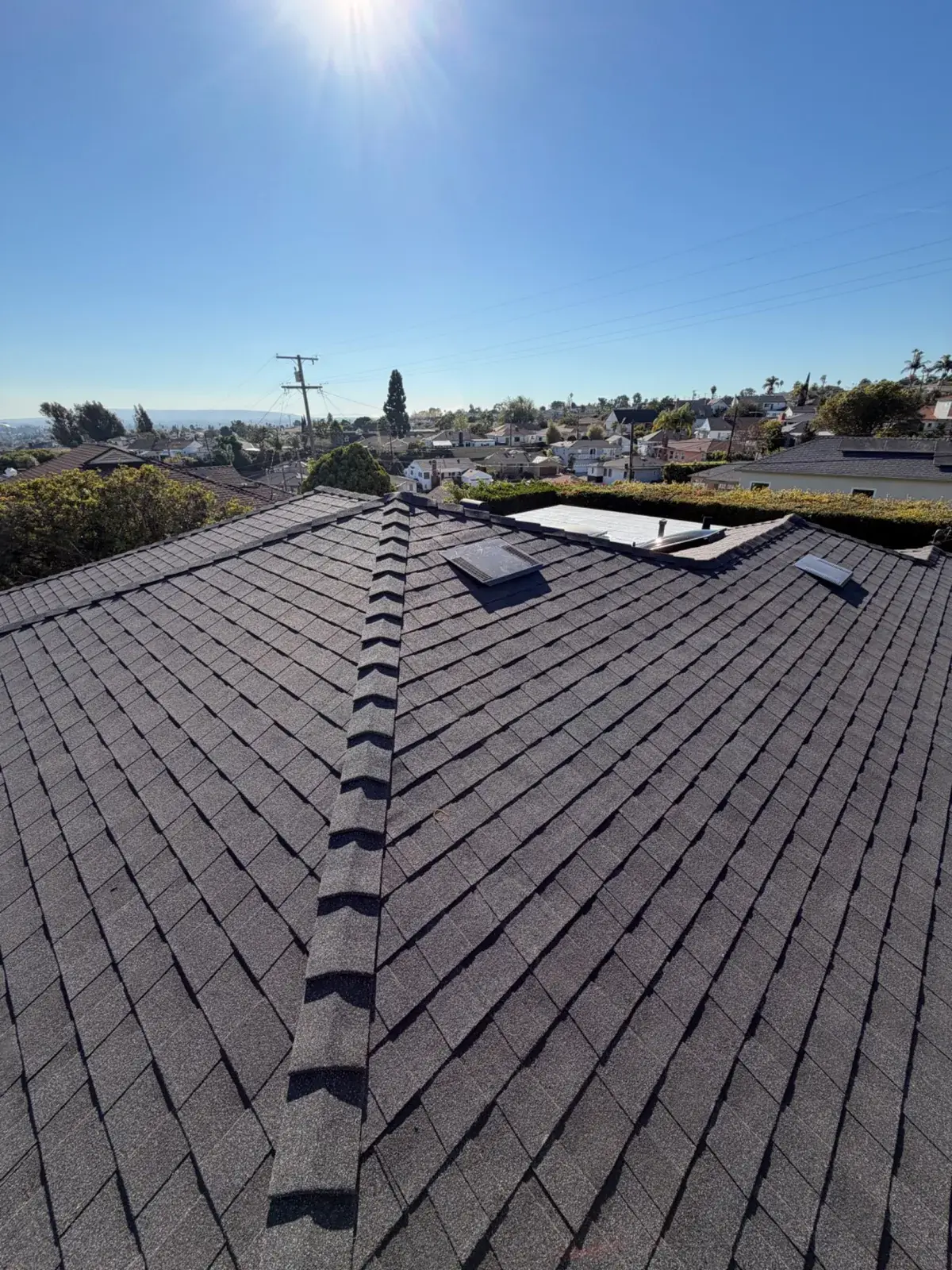 Completed roof ridge and shingles on a Los Angeles home
