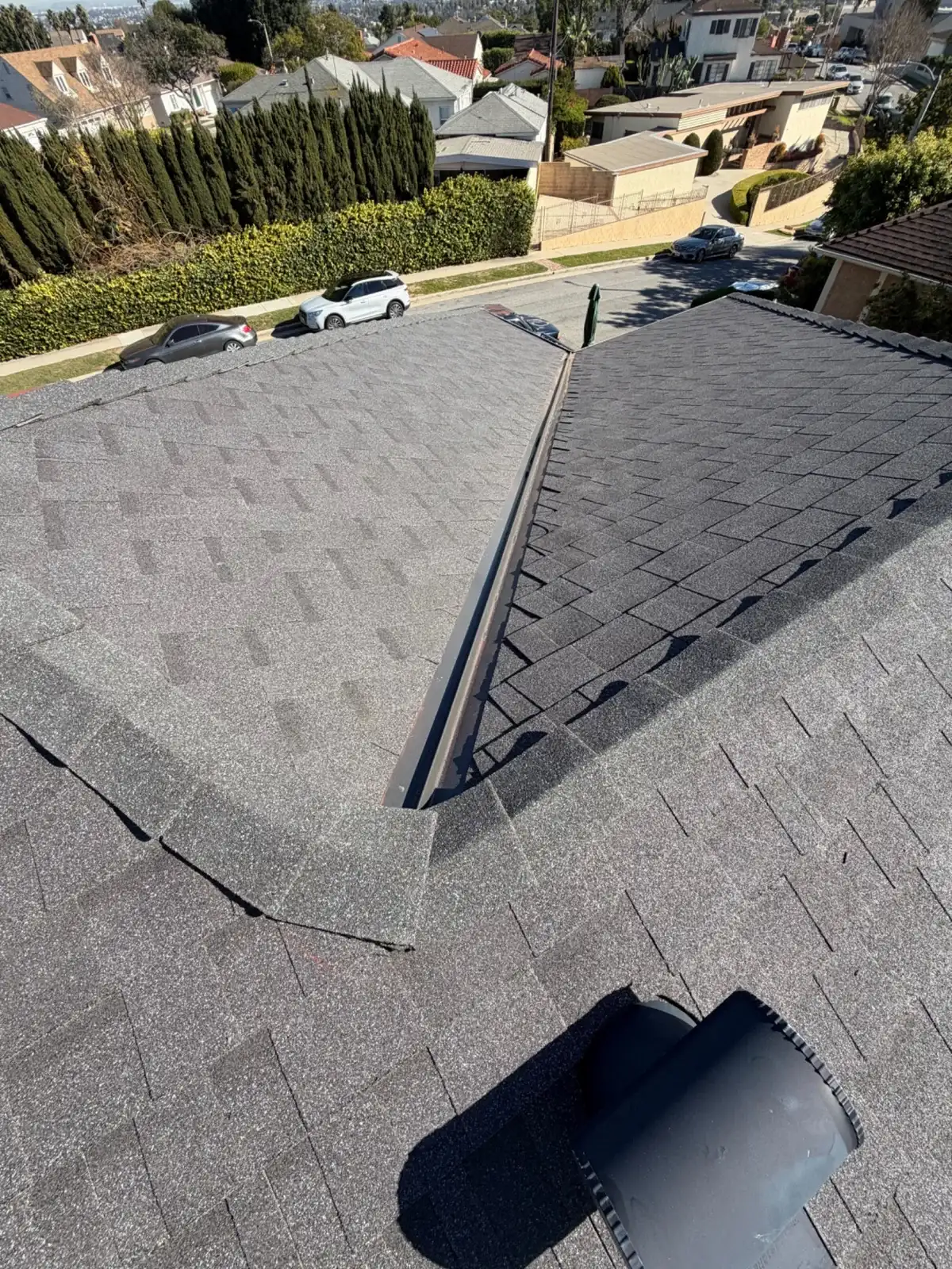 Finished grey architectural shingle roof after replacement