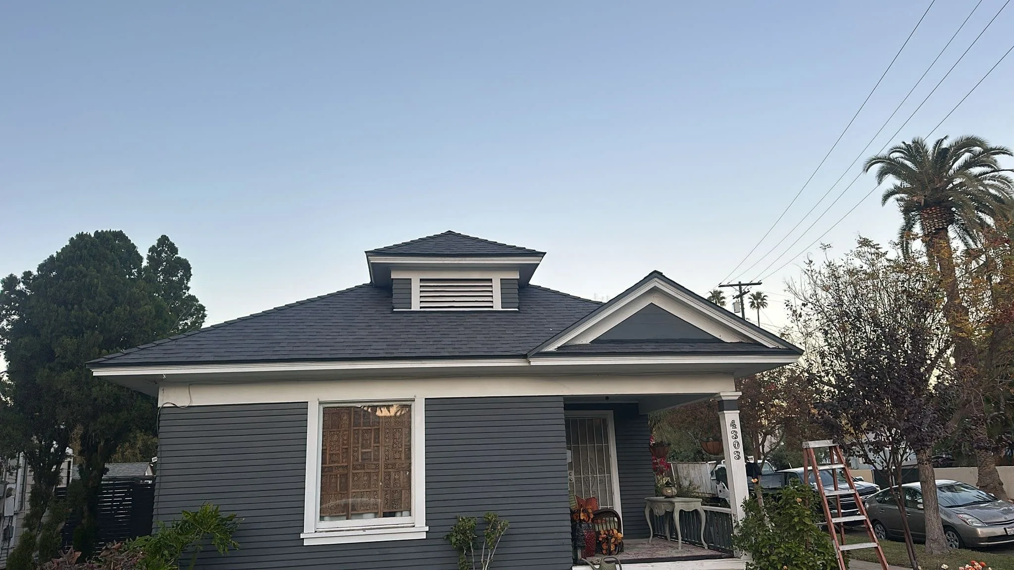 Craftsman bungalow with a new charcoal shingle roof and a front dormer