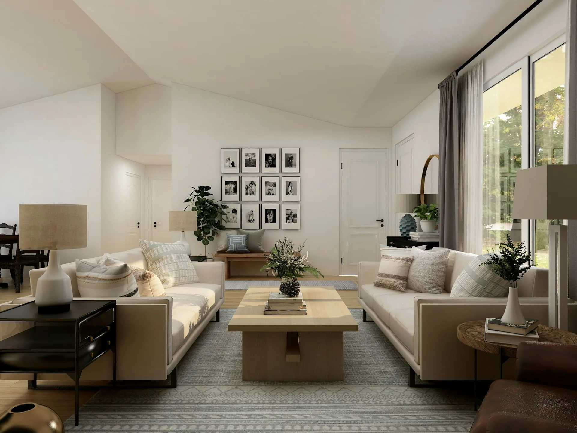Bright living room with cream sofas, a timber coffee table and a gallery wall of framed photos under a vaulted ceiling