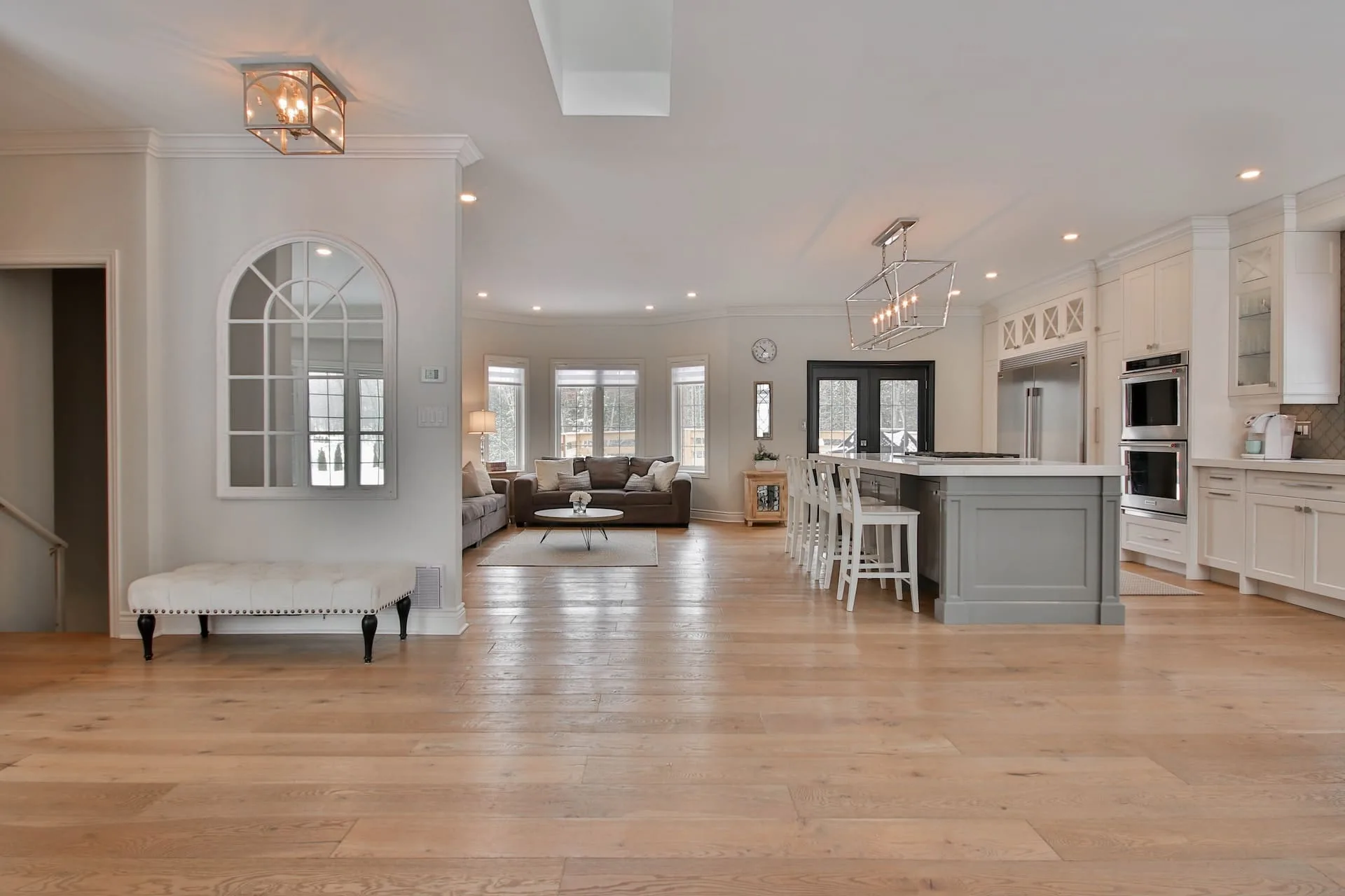 Wide-plank oak floors through an open-plan home