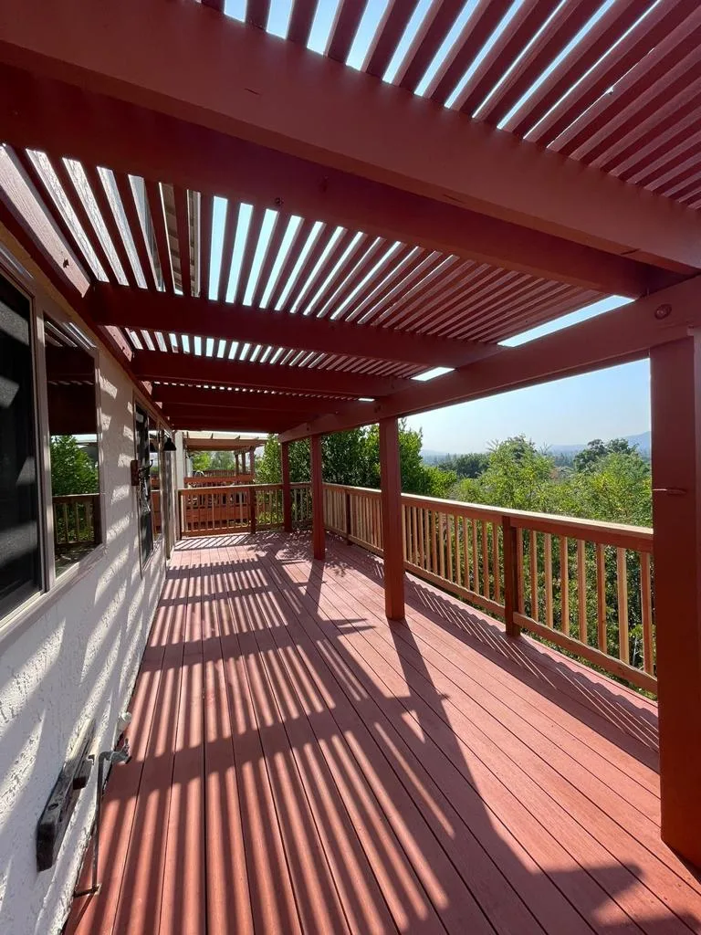 Red-stained wood deck under a slatted pergola with timber railings at 588 Via Primavera, San Jose