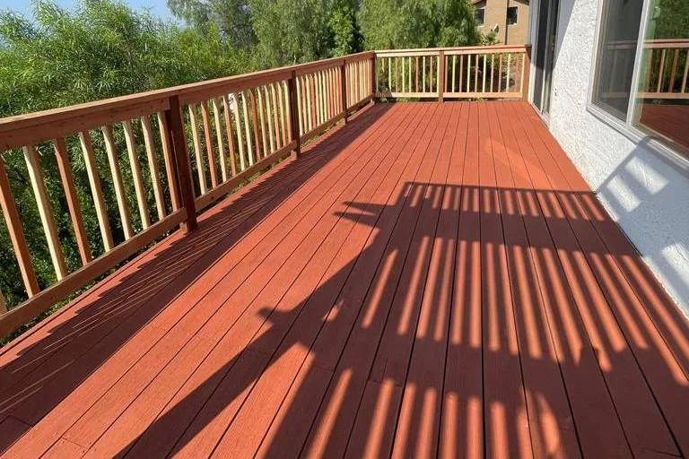 Red-stained wood deck with timber railings along the back of a stucco home at 588 Via Primavera, San Jose