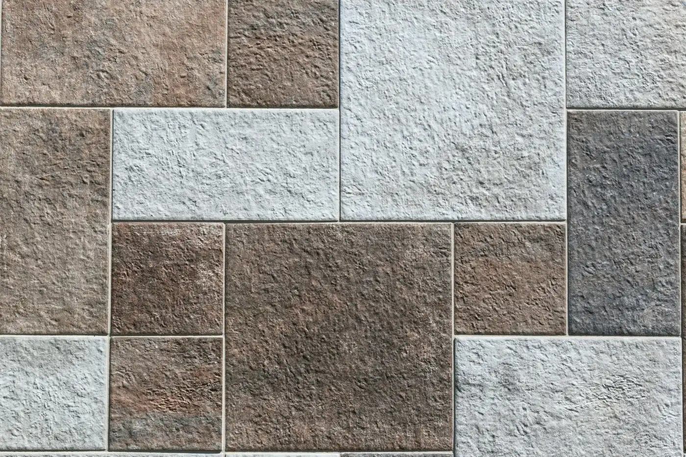Natural stone floor tiles in mixed gray and brown tones